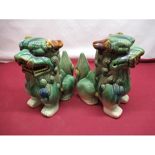 241 - Pair of Chinese Tang style dog of foo figures, H26cm