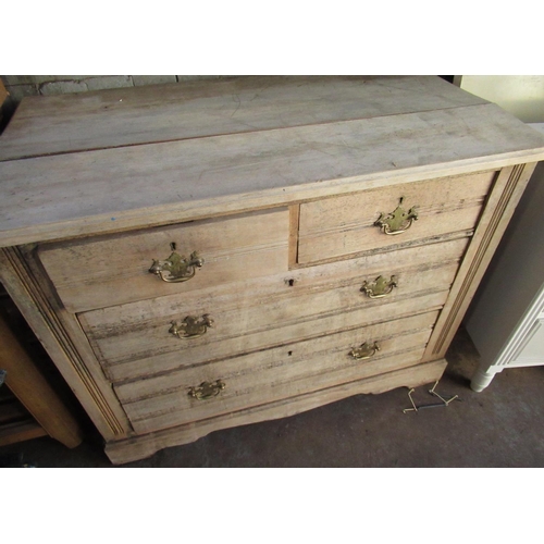 569 - Edwardian stripped walnut chest of two short above two long drawers, with brass handles, W100cm D54c... 