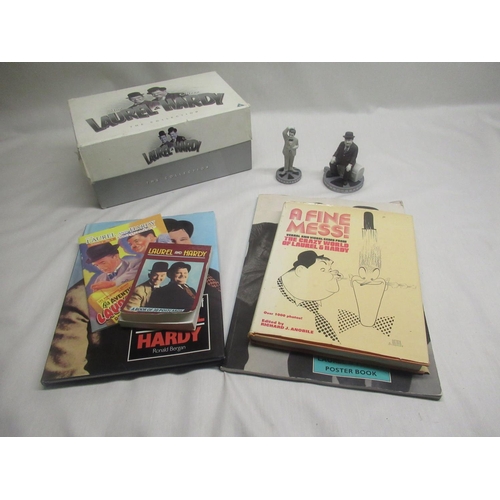 587 - Selection of Laurel and Hardy collectables incl. porcelain figurines, books and DVD collection