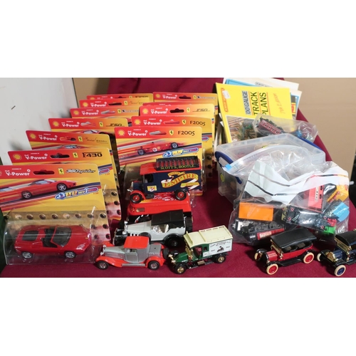 594 - Collection of plastic and diecast model vehicles including: trains, boxed Ferrari F30, and other box... 