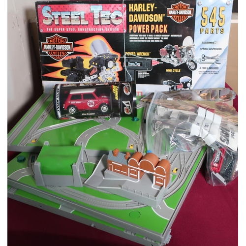 594 - Collection of plastic and diecast model vehicles including: trains, boxed Ferrari F30, and other box... 