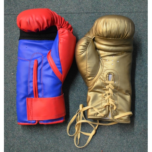 597 - Two signed boxing gloves (signature unidentifiable)