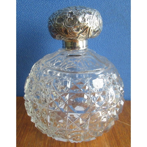 84 - Victorian cut glass scent bottle with repousse decorated hallmarked Sterling silver mounts, makers m... 