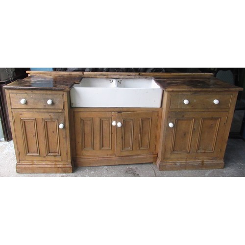 601 - Double Belfast sink with white ceramic handles set in pine surround, W216cm D71cm H90cm