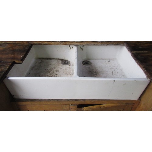 601 - Double Belfast sink with white ceramic handles set in pine surround, W216cm D71cm H90cm