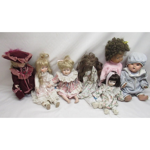 150 - Early to mid C20th papier mache doll together with six modern porcelain dolls and one other plastic ... 