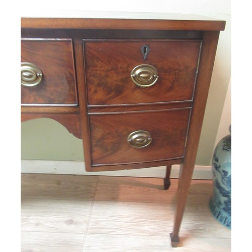 193 - Geo. III style mahogany bowfront kneehole sideboard, with drawer and two doors on square tapered sup... 