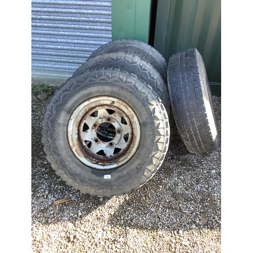 32 - Set of 4 Landrover Defender 90 wheels fitted with oversized tyres