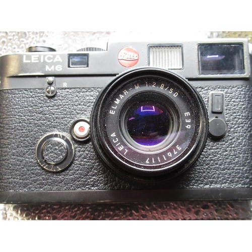 1077 - Leica M6 in black finish with Leica Elmar 50mm F2.8 collapsible lens, camera serial no. 1704853
(wit... 