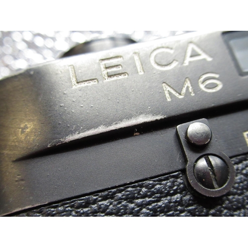 1077 - Leica M6 in black finish with Leica Elmar 50mm F2.8 collapsible lens, camera serial no. 1704853
(wit... 