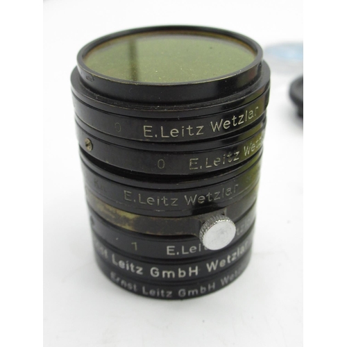 1113 - Selection of various Leica push on filters, screw in filters, lens caps, back caps, etc