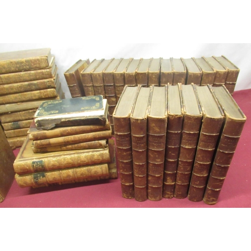 1393 - Large collection of leather bound books in varying states and conditions, including a twenty one vol... 