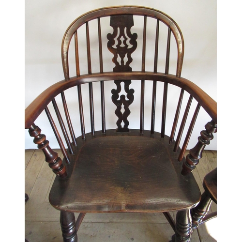 1528 - Set of three early C19th yew and elm wood low back Windsor armchairs, with fir tree splats and saddl... 