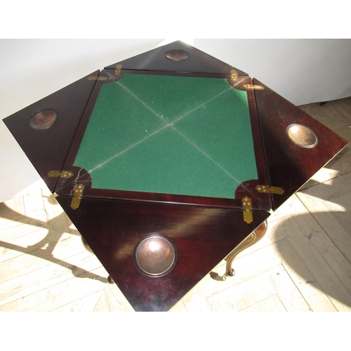 1530 - Edwardian mahogany envelope card table, swivel baize lined top with blind fret frieze including one ... 