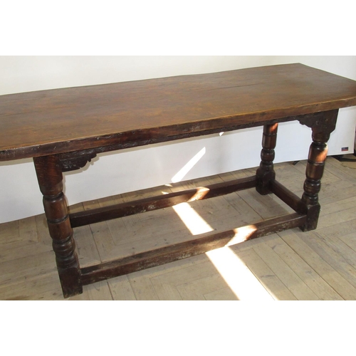 1545 - C18th and later oak refectory style dining table, planked top with scroll carved frieze on baluster ... 