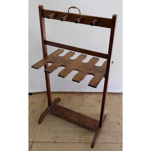 1549 - Early C20th Country House mahogany boot and whip rack, with eight pegs, brass carry handle on outspl... 