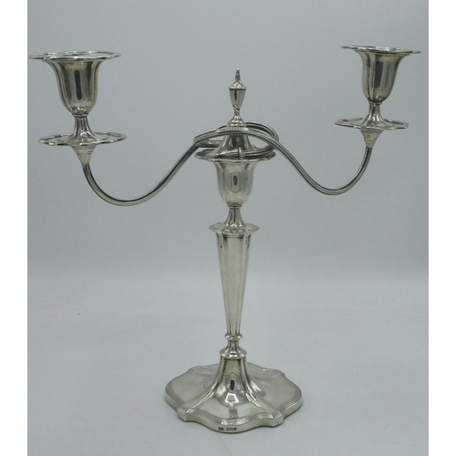 1143 - Geo.V hallmarked Sterling silver Regency style two light candelabra, twin scroll branches with urn s... 