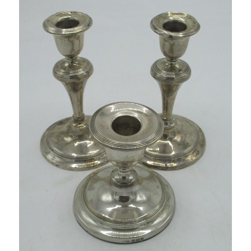 1150 - Pair of Geo.V hallmarked Sterling silver candlesticks with knopped columns on circular bases, by W J... 