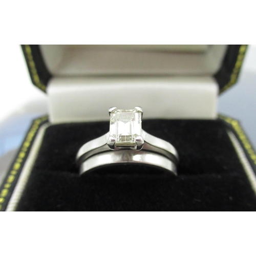 1124 - Hallmarked platinum solitaire ring with emerald cut diamond in four claw setting, 0.70ct, colour H, ... 