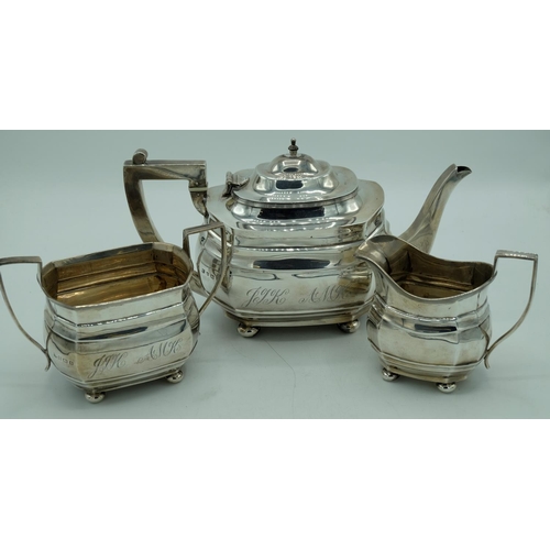 1141 - Geo.V hallmarked Sterling silver three piece tea service, stepped shaped rectangular bodies with sim... 