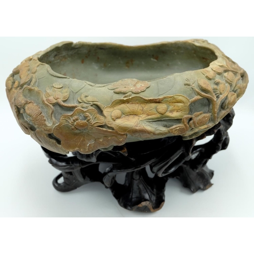 1289 - Chinese dark green and brown Duan stone brush washer in the form of a lily pad, rim carved with fish... 