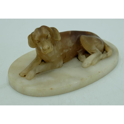 1294 - Pair of C20th alabaster models of recumbant hounds, on oval bases, W14.5cm H8cm