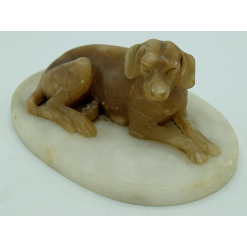 1294 - Pair of C20th alabaster models of recumbant hounds, on oval bases, W14.5cm H8cm