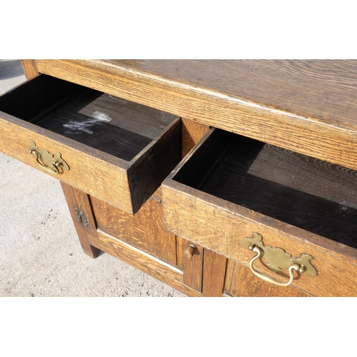 1556 - Craftsman made oak dressser, twin shelf back with moulded cornice and shaped frieze, projecting base... 