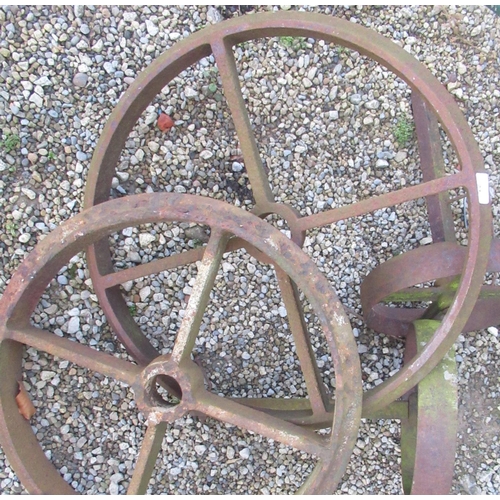 23 - Two sets of cast iron wheels