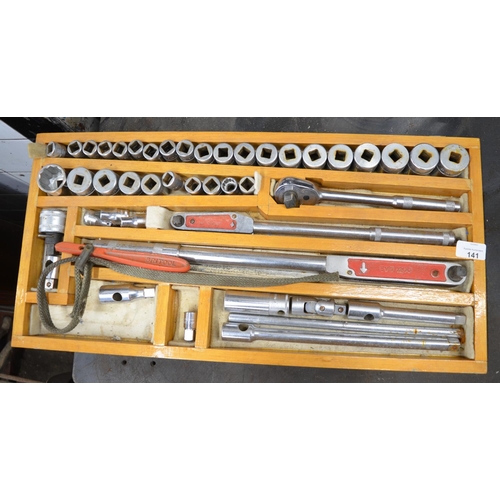 141 - Box containing large collection of sockets with extensions and torque wrench