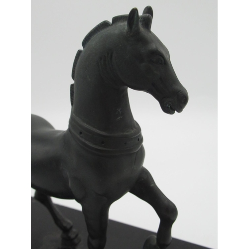 1297 - After the Antique, patinated bronze model of a Roman prancing horse, on polished rectangular base, H... 