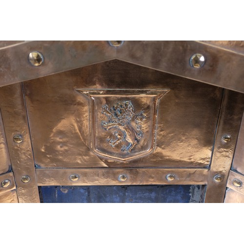 1417 - C20th beaten copper fire insert, the angular arched recess with heraldic lion cresting, W99cm D18cm ... 