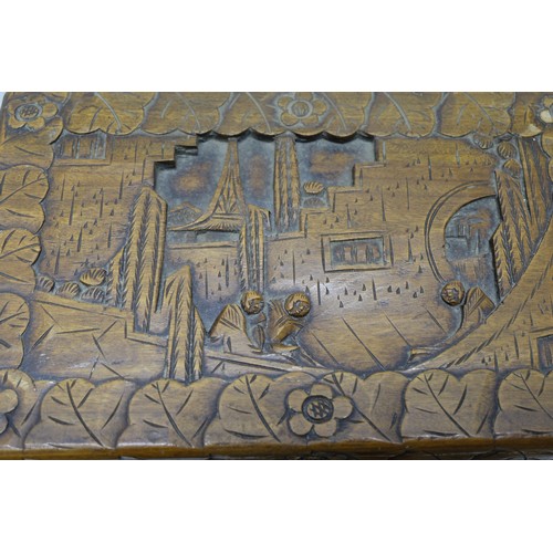 1311 - Nest of three C20th Chinese camphor rectangular boxes, deep carved with landscapes, figures in lands... 