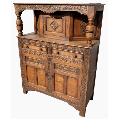 1558 - Charles II style oak court cupboard with scroll carved cornice on baluster turned supports, two moul... 