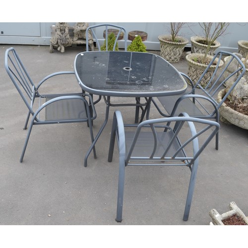 161 - Set of four steel garden chairs with glass topped table