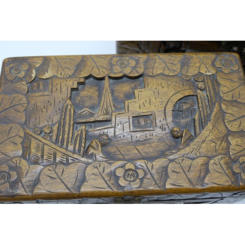 1311 - Nest of three C20th Chinese camphor rectangular boxes, deep carved with landscapes, figures in lands... 