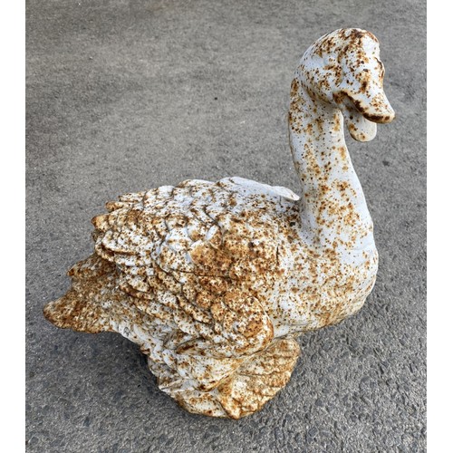 1597 - White painted cast iron garden model of a Swan, on naturalistic base, H50cm L46cm