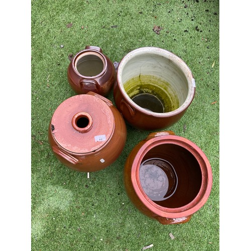 64 - Set of four stone glazed pots of various sizes and styles