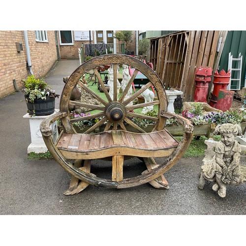 66 - Garden bench formed by a wooden wagon wheel and slats approximately 53