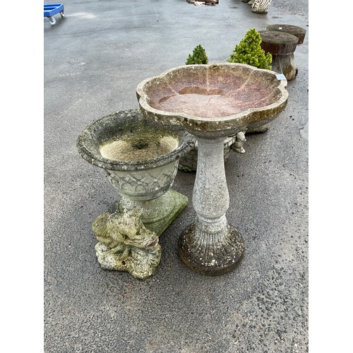 69 - Plastic bird bath on plinth and a composite stone planter with lattice work and a composite squirrel