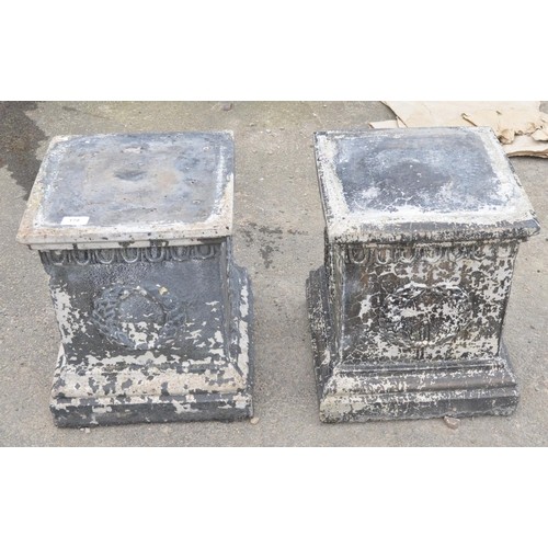 177 - Two reconstituted stone plinths, with laurel design