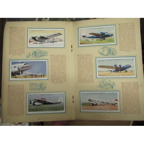 218 - Two c1930s albums of cigarette cards, together with some named picture ard album sets, small book of... 