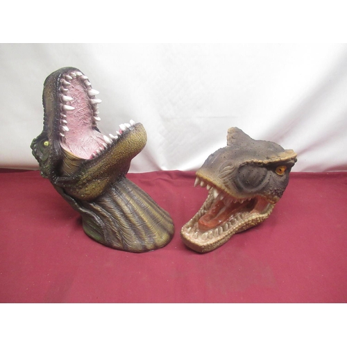 85 - Two resin Tyrannosaurus Rex wall mounting heads, four plastic Velociraptor heads and hands (6)