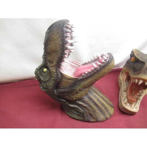 85 - Two resin Tyrannosaurus Rex wall mounting heads, four plastic Velociraptor heads and hands (6)