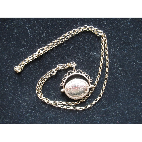13 - Hallmarked 9ct yellow gold swing locket with bright cut decoration, stamped 375, on belcher chain wi... 