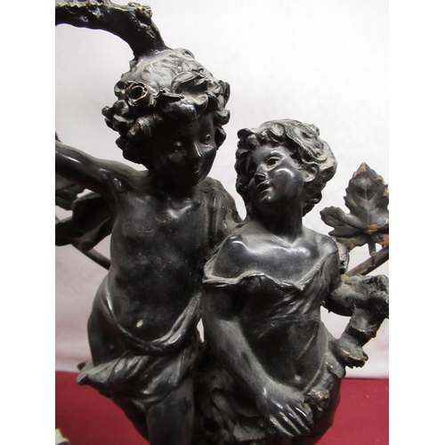 157 - Cast metal figural three light table lamp of two cherubic figures on ebonized base, indistinctly sig... 