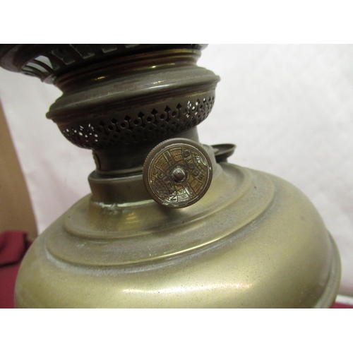 182 - Brass oil lamp on black terracotta base with chimney and white globe shade, and a Veritas brass oil ... 