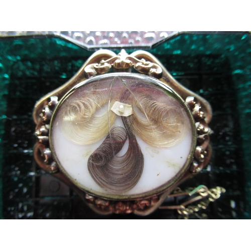 22 - Victorian mourning brooch with hairwork panel in pinchbeck mount with safety chain, another pinchbec... 