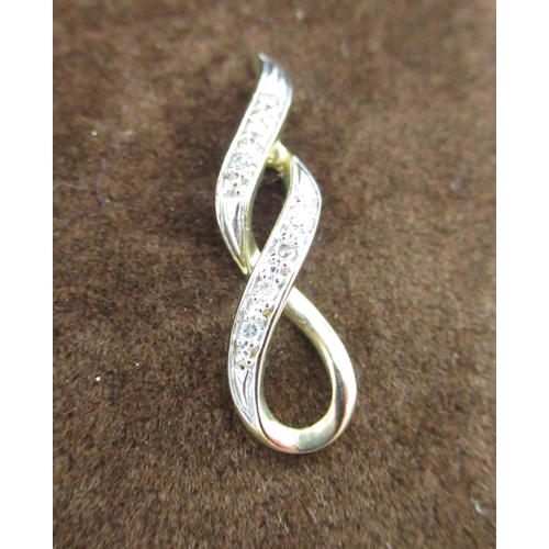 38 - Hallmarked 9ct yellow gold figure eight pendant inset with round cut diamonds by S.G, 375, London, L... 