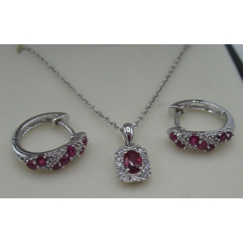42 - 9ct white gold ruby and diamond hoop earrings inset with seven rubies and ten round cut diamonds and... 